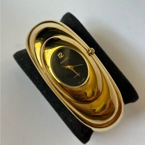 Vintage Gruen Gold-Tone Oval Cuff Watch with Black Dial